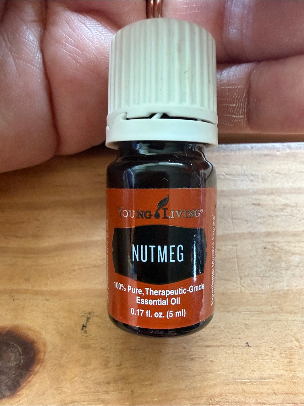 Young Living Nutmeg Essential Oil - Amber Bottle with White Cap and Orange Label